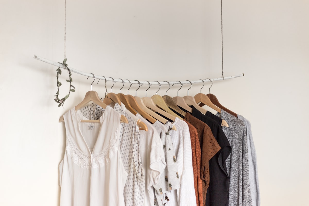 Two women in coordinated autumn street-style looks that anchor a timeless capsule wardrobe